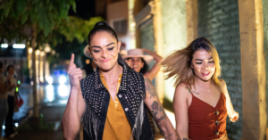 lesbian couple at night walking together