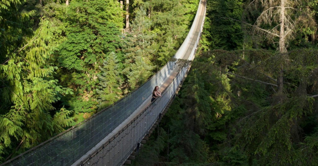 queer femme woman on the Capilano Suspension Bridge Park in Vancouver