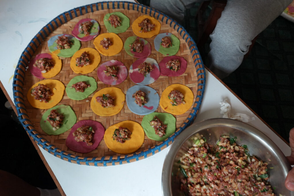colorful momos with buffalo meat, unfolded