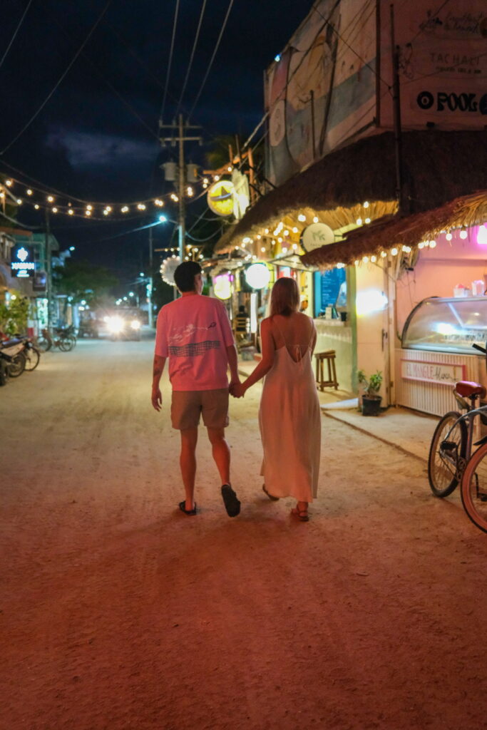 lesbian couple holding hands in Holbox mexico 