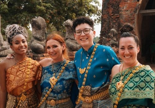 Queer people in Traditional Thai clothing at a temple in Thailand